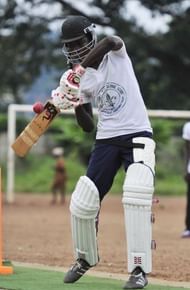 A man plays cricket at Kingtom Oval in Freetown, Sierra Leone's only cricket ground, on November 15, 2012